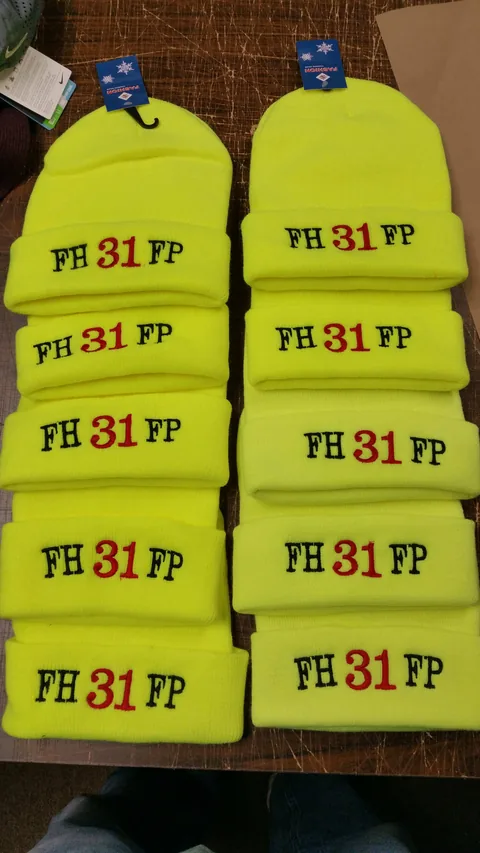 Hi-vis beanies embroidered with a fire department logo