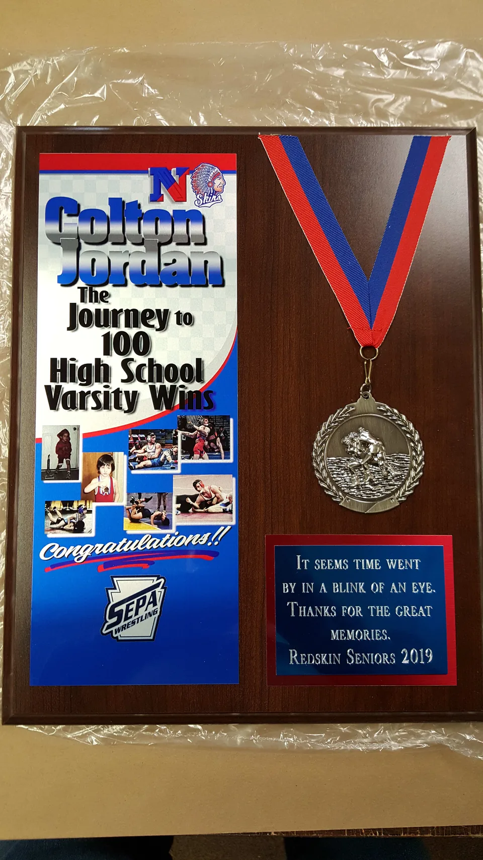 Wrestling achievement plaque with a mounted medal and printed photo panel