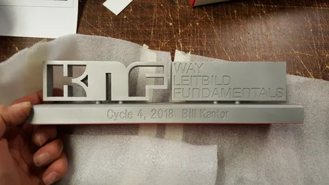Laser-cut brushed aluminium corporate award